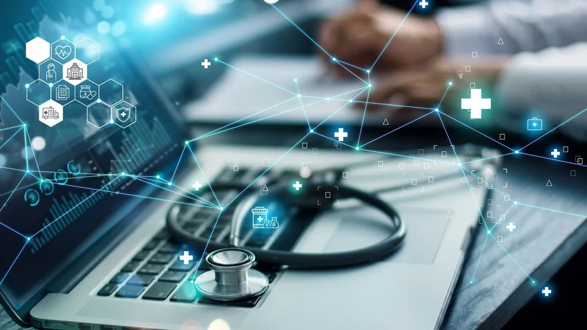 Doctors stethoscope resting on a laptop keyboard.